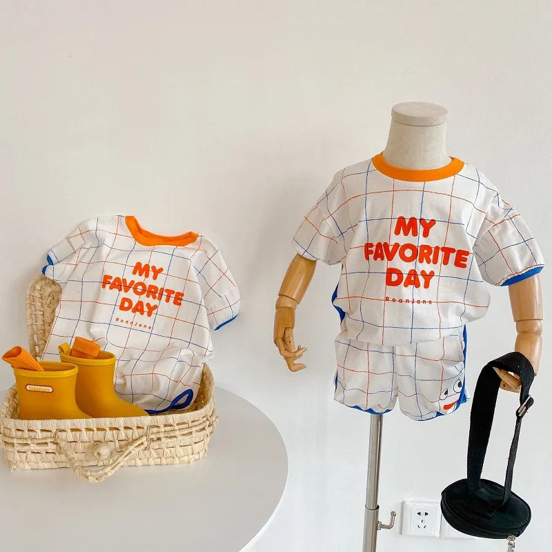 𝐶𝑜𝑡𝑡𝑜𝑛 𝑃𝑙𝑎𝑖𝑑 𝑆ℎ𝑜𝑟𝑡 𝑆𝑙𝑒𝑒𝑣𝑒 𝑇𝑜𝑝 + 𝑠ℎ𝑜𝑟𝑡𝑠 𝑆𝑢𝑖𝑡𝑠